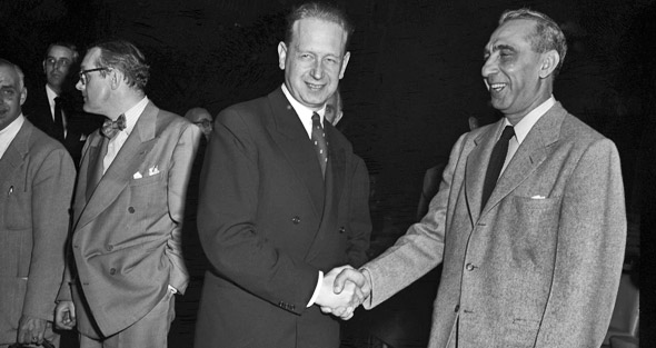 Moments before being installed as Secretary-General, Hammarskjöld (left) with Ambassador Bokhari of Pakistan. Moments before being installed as Secretary-General, Hammarskjöld (left) with Ambassador Bokhari of Pakistan.